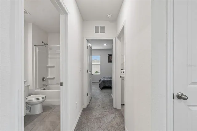 an aerial view of a house with outdoor space