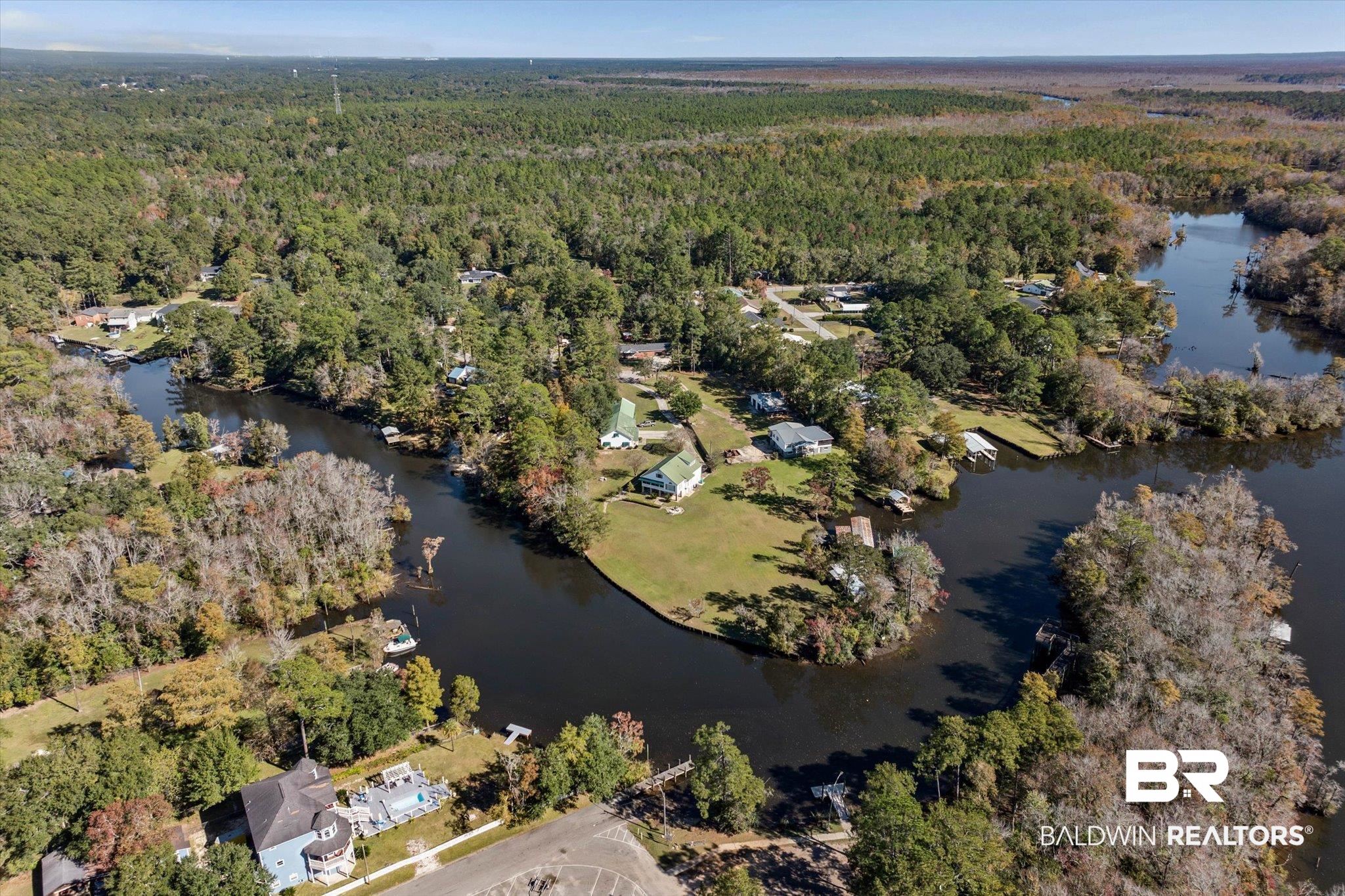 431 Simms Drive Saraland, AL 36571 - Photo 27 of 34 Aerial overview of property's location featuring a forest and a nearby body of water