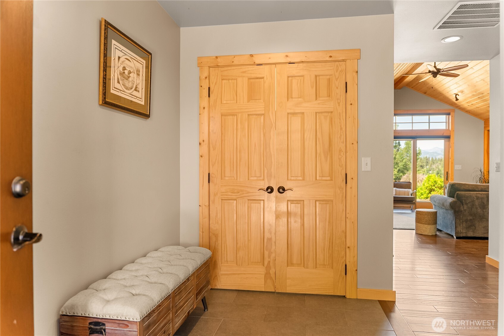 130 Sundown Road Winthrop, WA 98862 - Photo 8 of 40 a view of a bedroom with wooden floor and windows