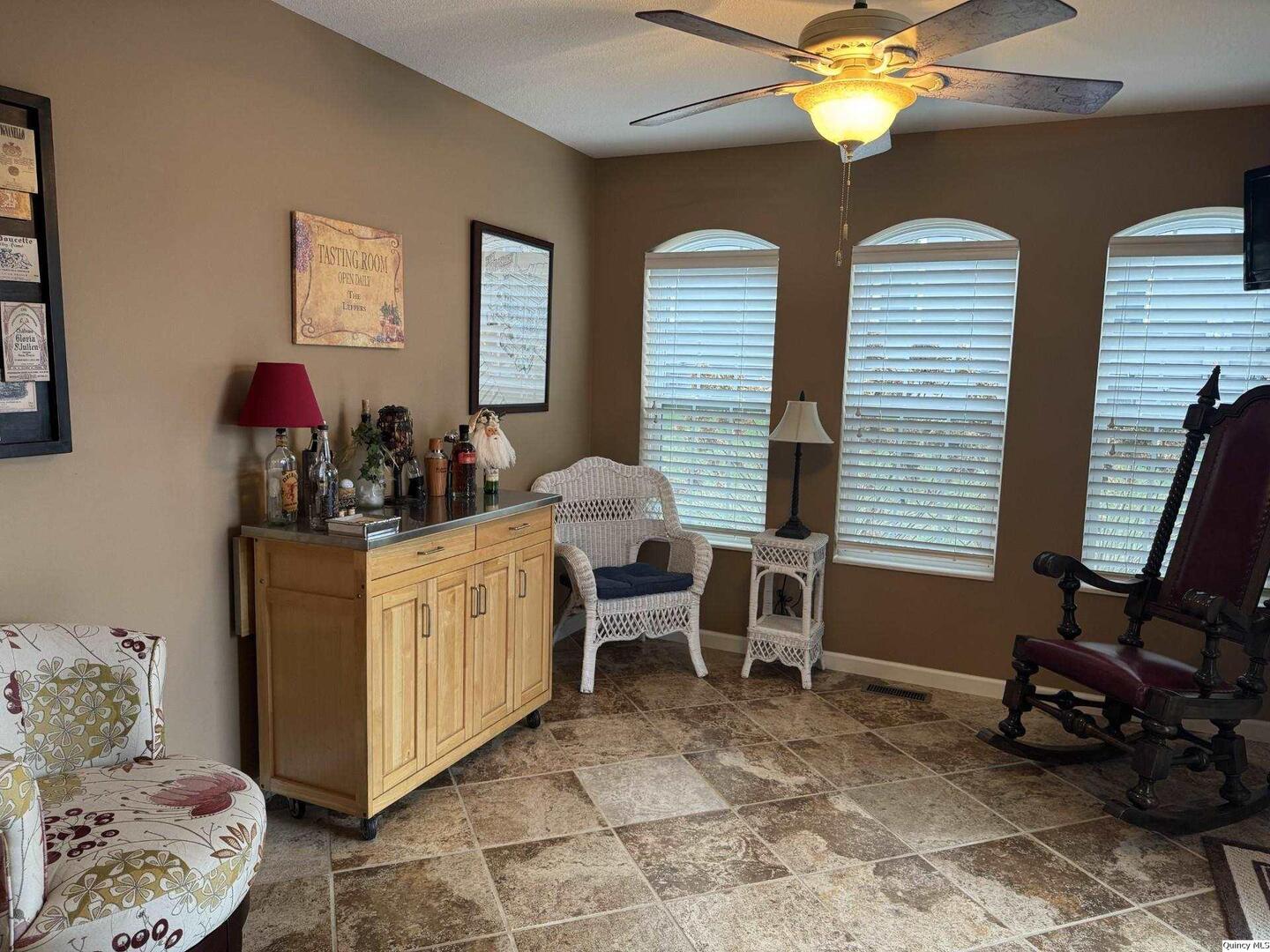 5001 Chestnut Street Quincy, IL 62305 - Photo 3 of 15 a room with furniture a chandelier and a window
