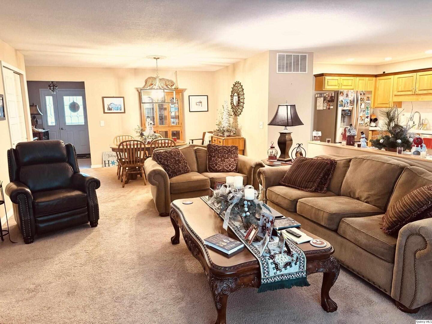 5001 Chestnut Street Quincy, IL 62305 - Photo 4 of 15 a living room with furniture and a large window