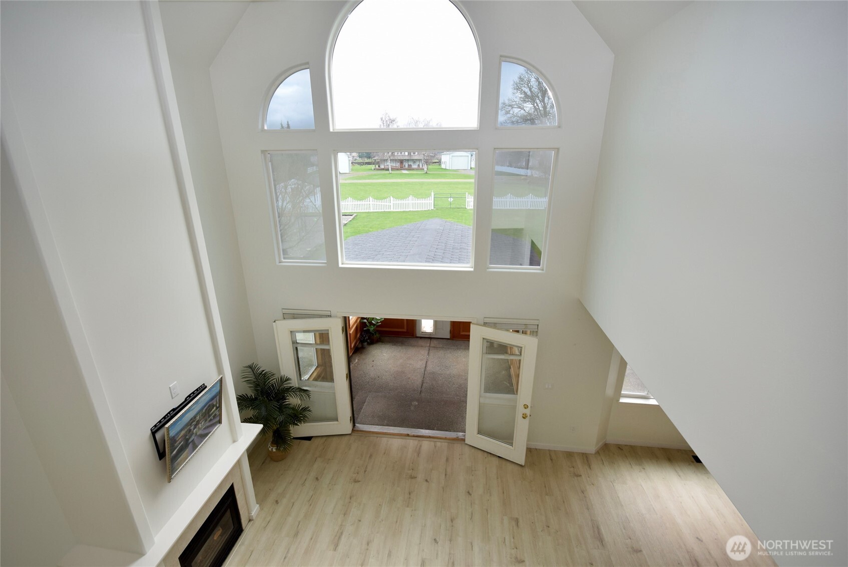 71 John Carl Road Sequim, WA 98382 - Photo 8 of 37 a view of an empty room with wooden floor and a window