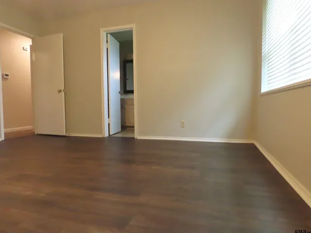 a bathroom with a sink vanity and a mirror
