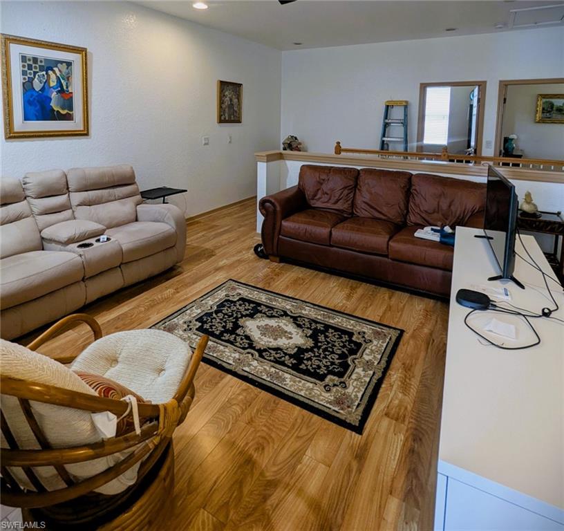 20176 Larino Loop Estero, FL 33928 - Photo 16 of 31 a living room with furniture and a rug