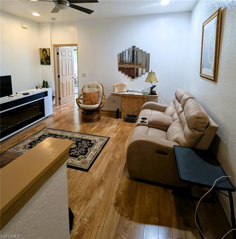 20176 Larino Loop Estero, FL 33928 - Photo 17 of 31 a living room with furniture and a flat screen tv
