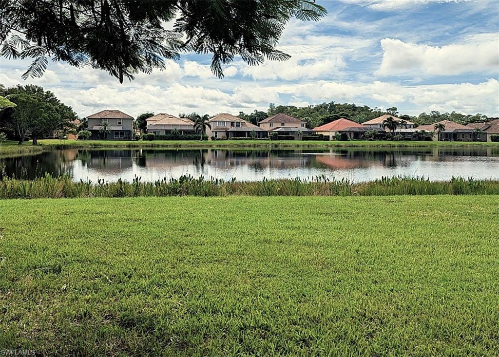 20176 Larino Loop Estero, FL 33928 - Photo 3 of 31 a view of a lake with houses in the back
