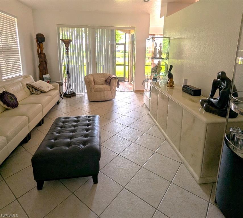 20176 Larino Loop Estero, FL 33928 - Photo 5 of 31 a living room with furniture and a large window