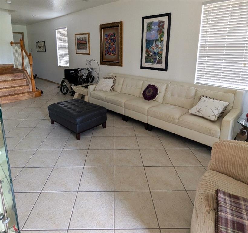 20176 Larino Loop Estero, FL 33928 - Photo 6 of 31 a living room with furniture and a window
