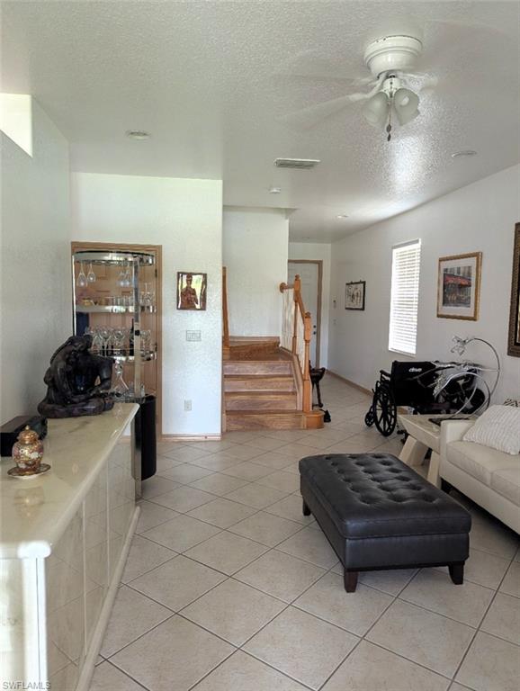 20176 Larino Loop Estero, FL 33928 - Photo 8 of 31 a living room with furniture and a dresser