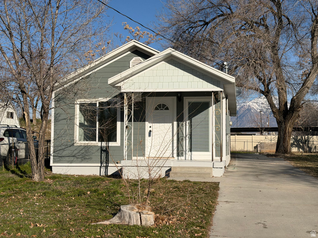 344 13th Street Ogden, UT 84404 - Photo 1 of 1 View of front of property with covered porch and driveway