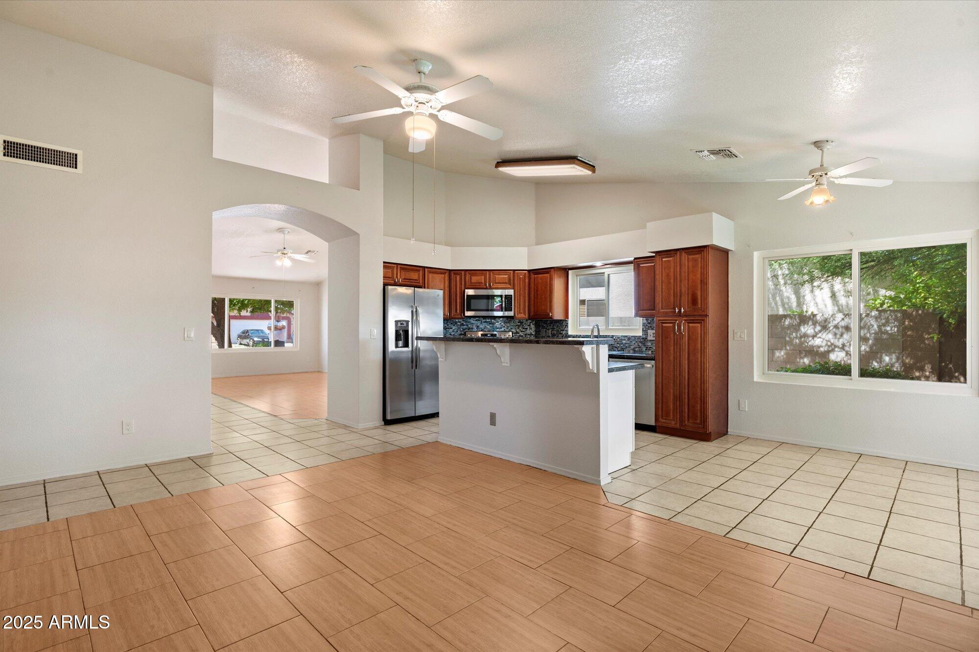 8540 West Ocotillo Road Glendale, AZ 85305 - Photo 7 of 22 a view of a kitchen with furniture and a kitchen