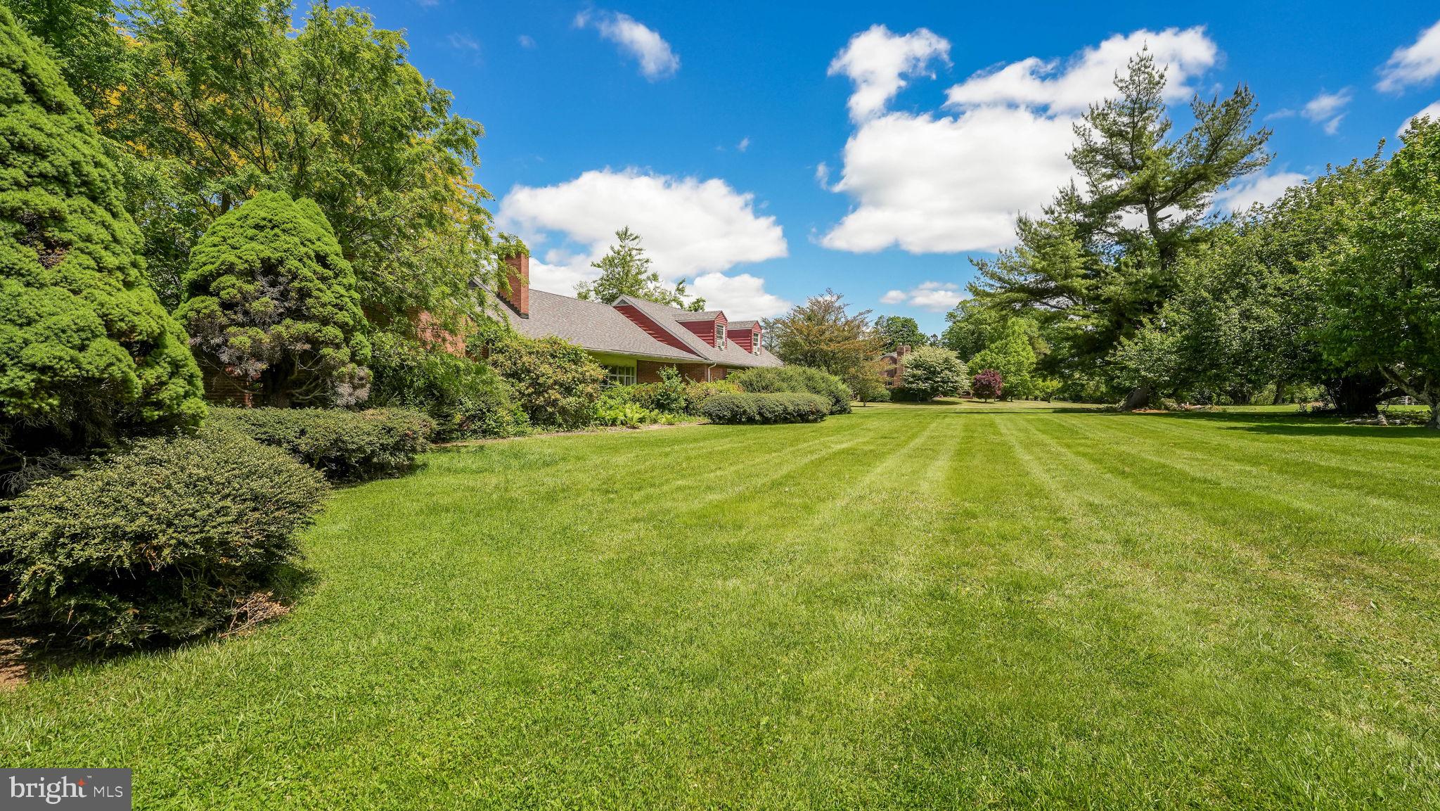 1591 Middletown Road Glen Mills, PA 19342 - Photo 4 of 55 a view of a golf course with a lake
