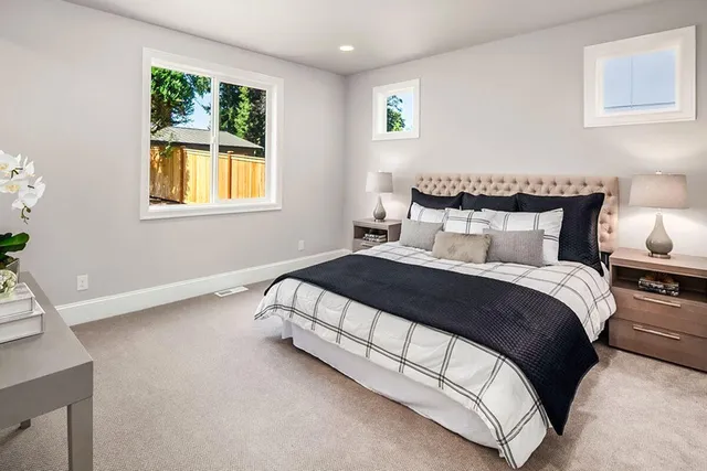 a bedroom with a bed and window