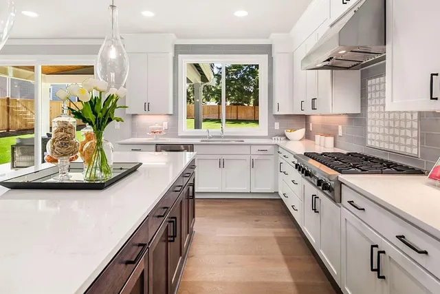 a kitchen with a sink stove and cabinets