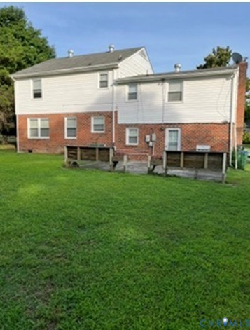 3732 Birdwood Road Richmond, VA 23234 - Photo 27 of 28 a view of a big house with a big yard and large trees