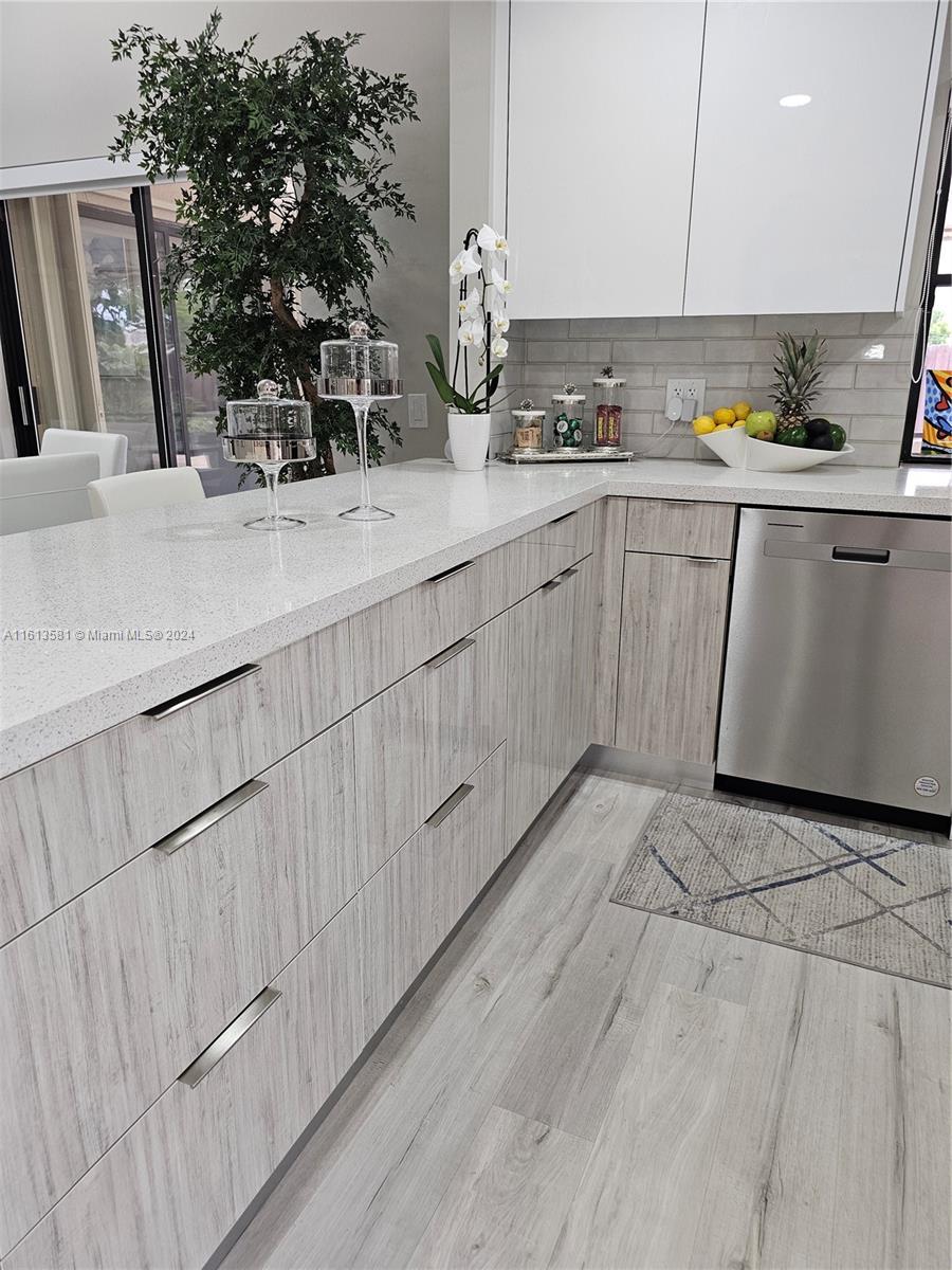 4323 Southwest 148th Place Miami, FL 33185 - Photo 16 of 70 a kitchen with a sink and cabinets
