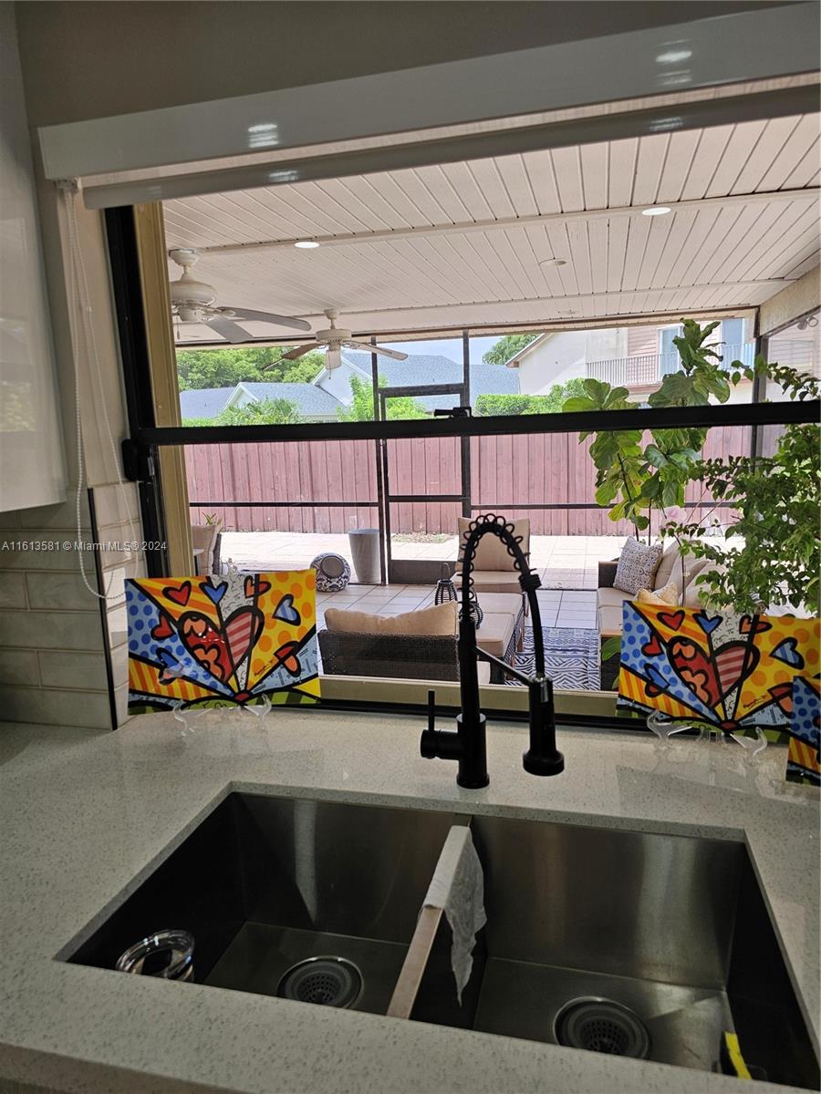 4323 Southwest 148th Place Miami, FL 33185 - Photo 20 of 70 View to Outdoor Back Patio from kitchen window