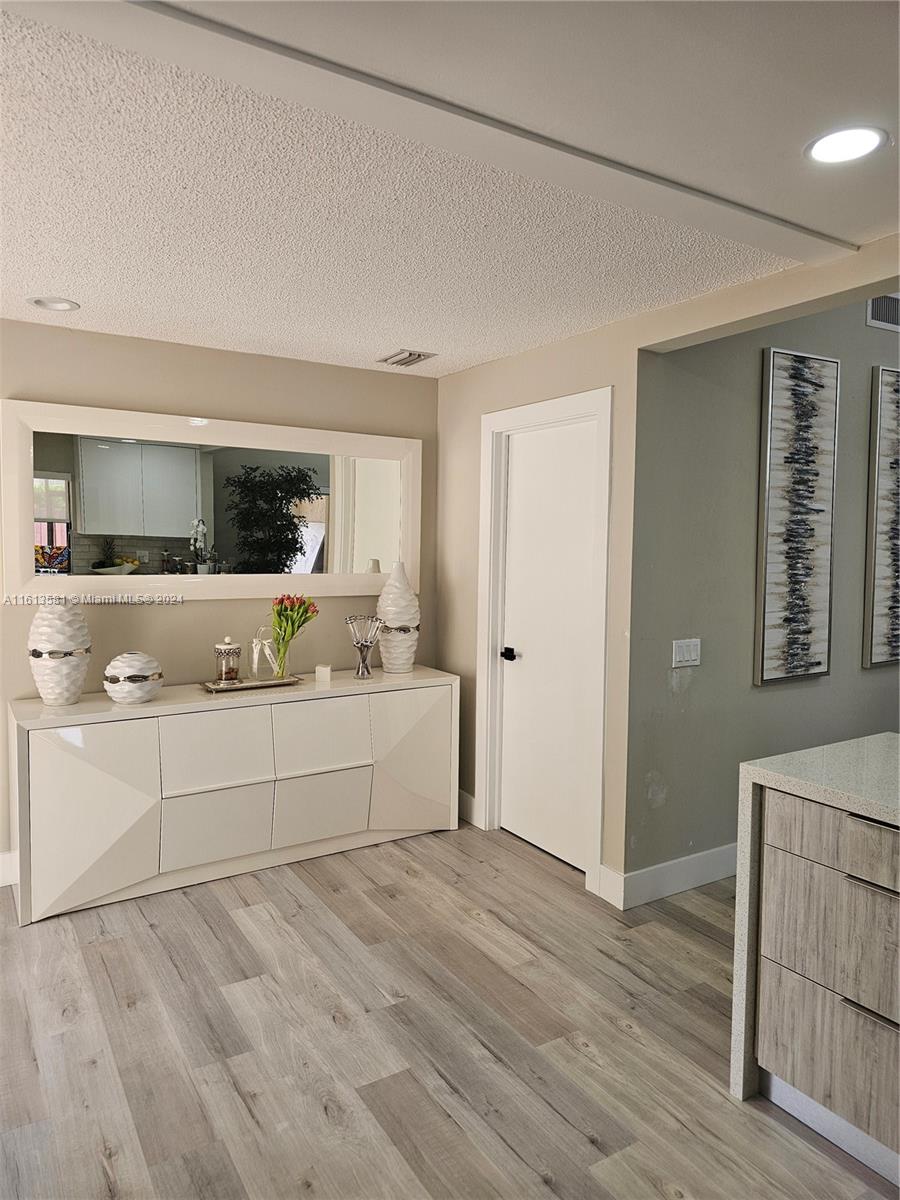 4323 Southwest 148th Place Miami, FL 33185 - Photo 21 of 70 a view of a kitchen with wooden floor and electronic appliances