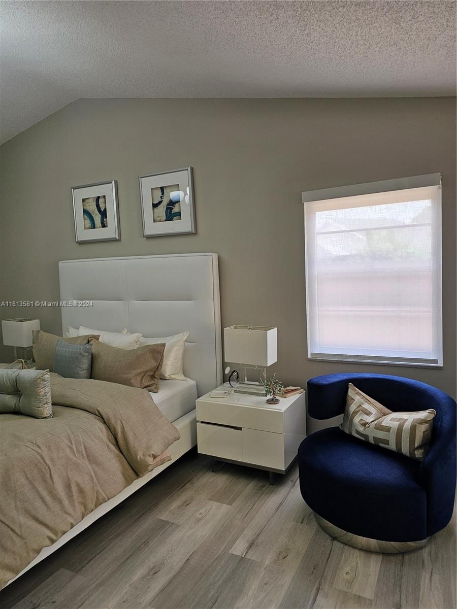 4323 Southwest 148th Place Miami, FL 33185 - Photo 26 of 70 a living room with couches and a night stand