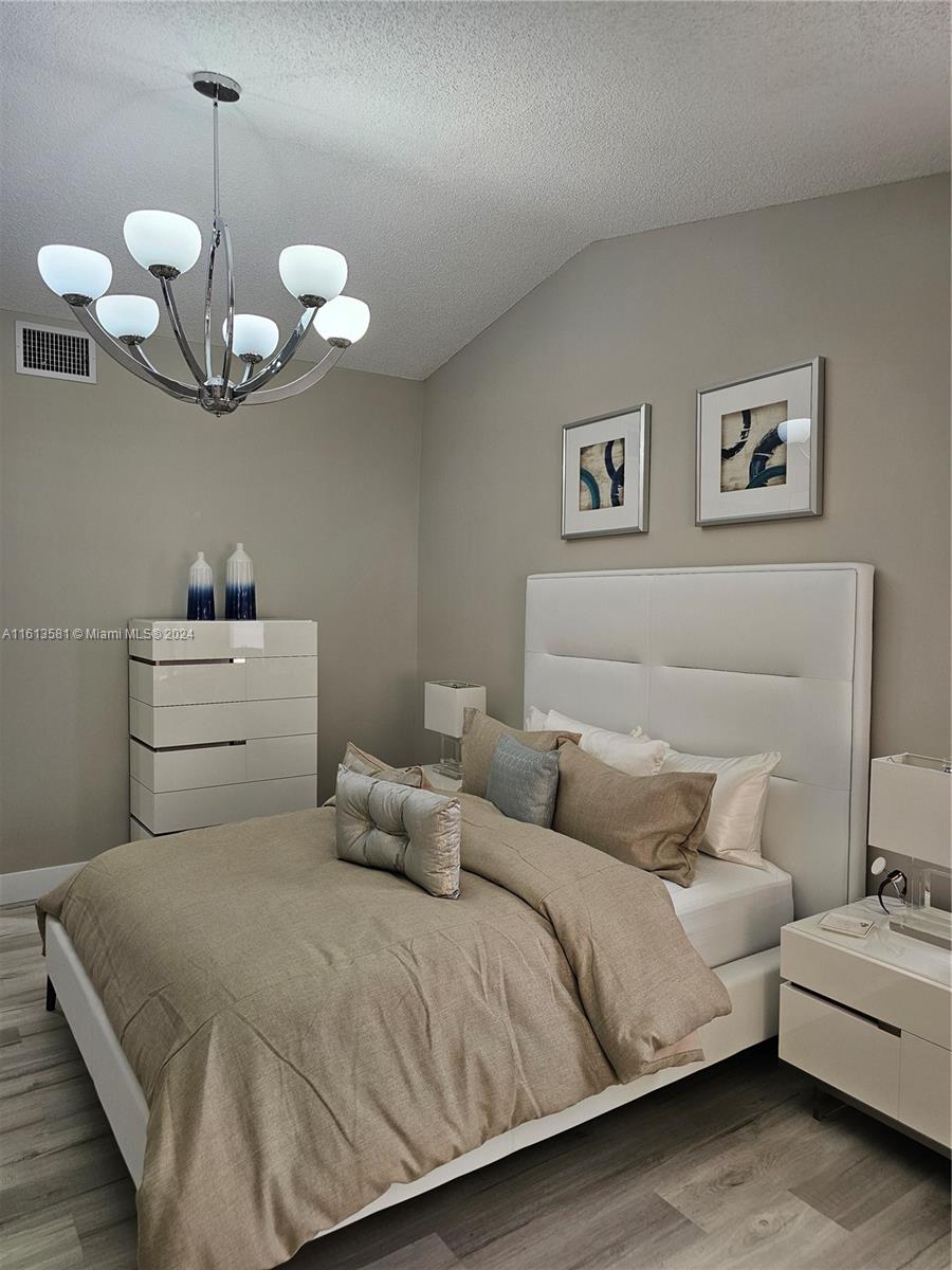4323 Southwest 148th Place Miami, FL 33185 - Photo 28 of 70 a bedroom with a bed and ceiling fan
