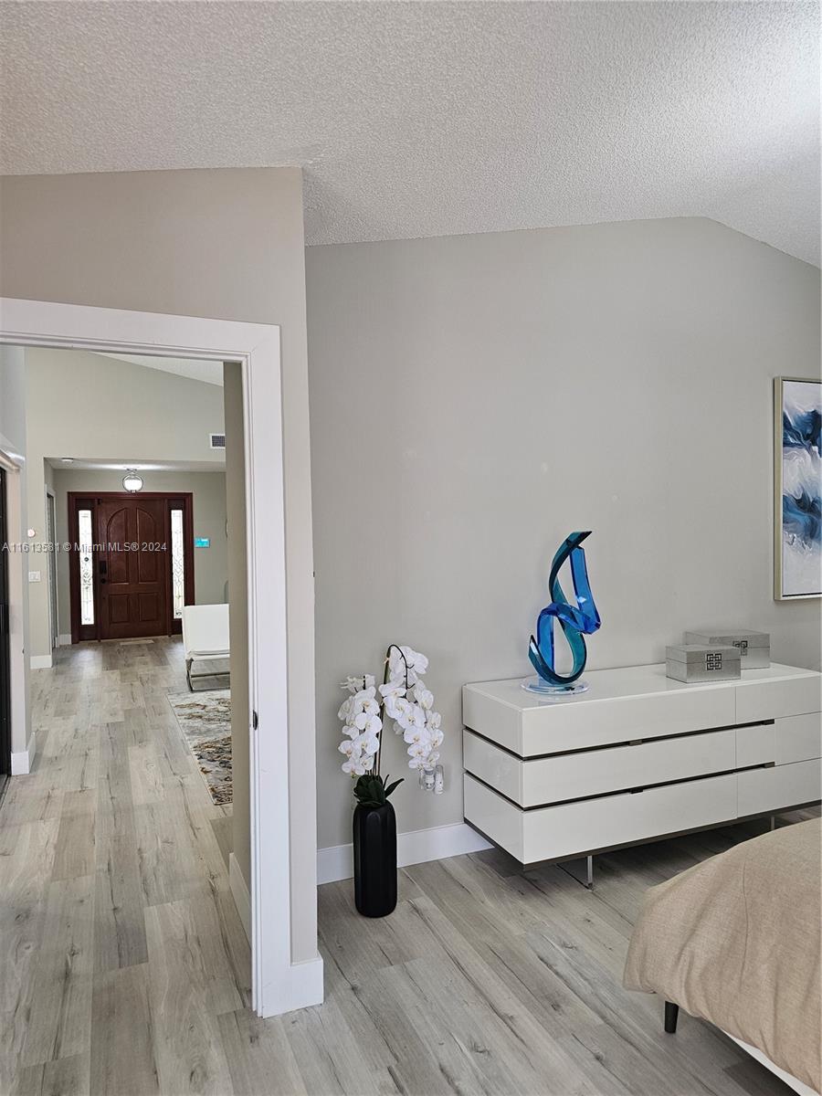 4323 Southwest 148th Place Miami, FL 33185 - Photo 29 of 70 a view of dining room with wooden floor and cabinet