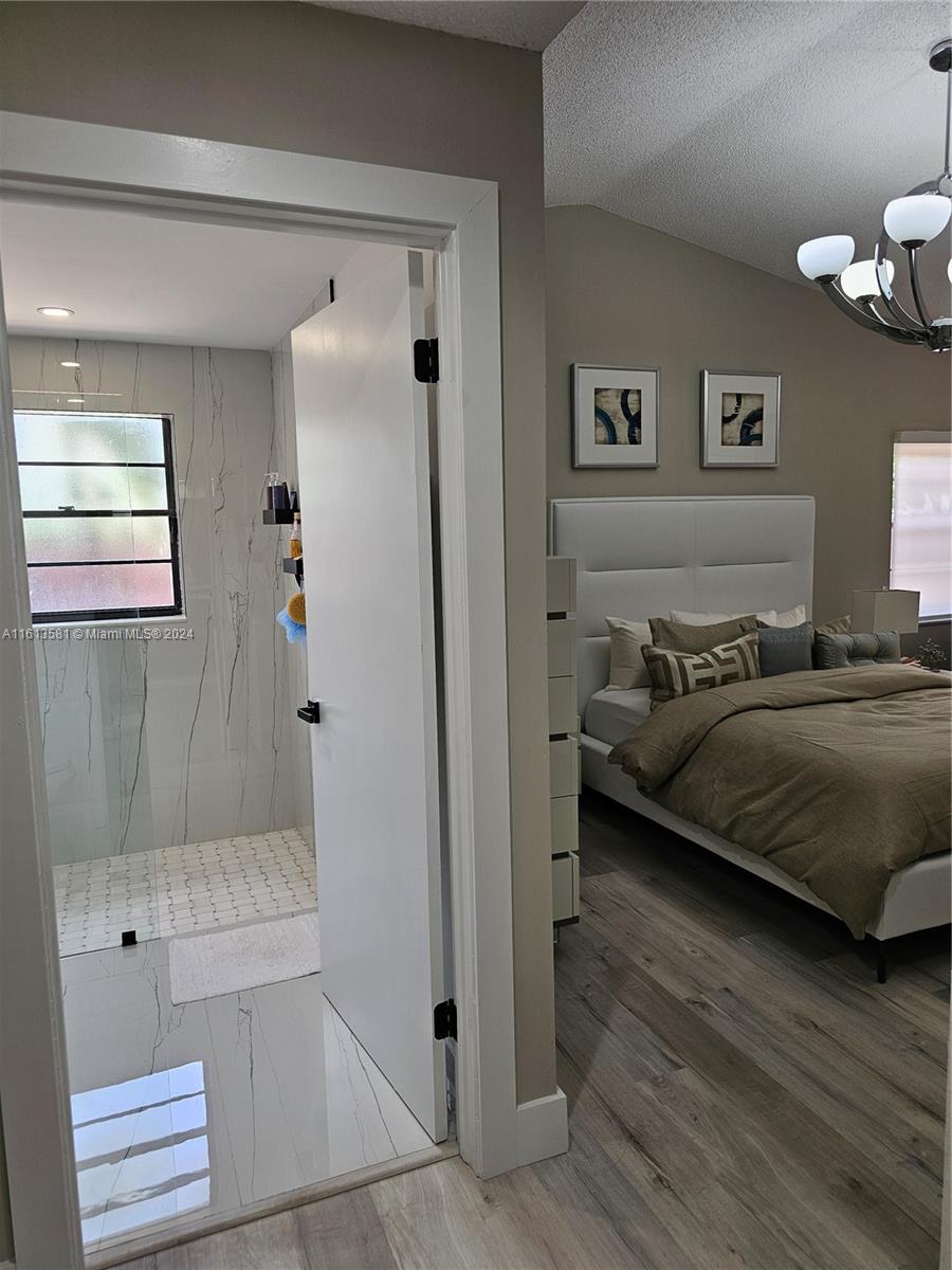 4323 Southwest 148th Place Miami, FL 33185 - Photo 30 of 70 a bedroom with a bed and a window