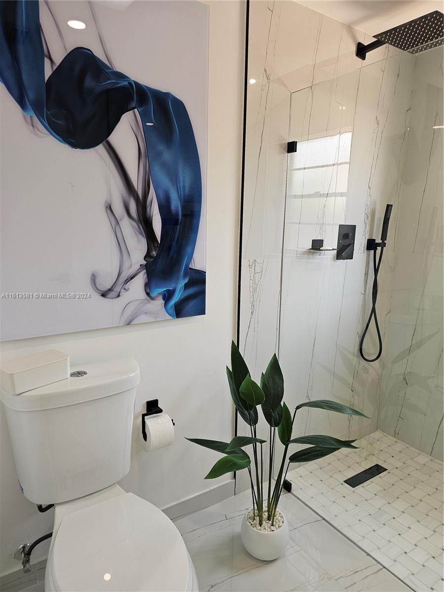 4323 Southwest 148th Place Miami, FL 33185 - Photo 31 of 70 a bathroom with a toilet and a shower
