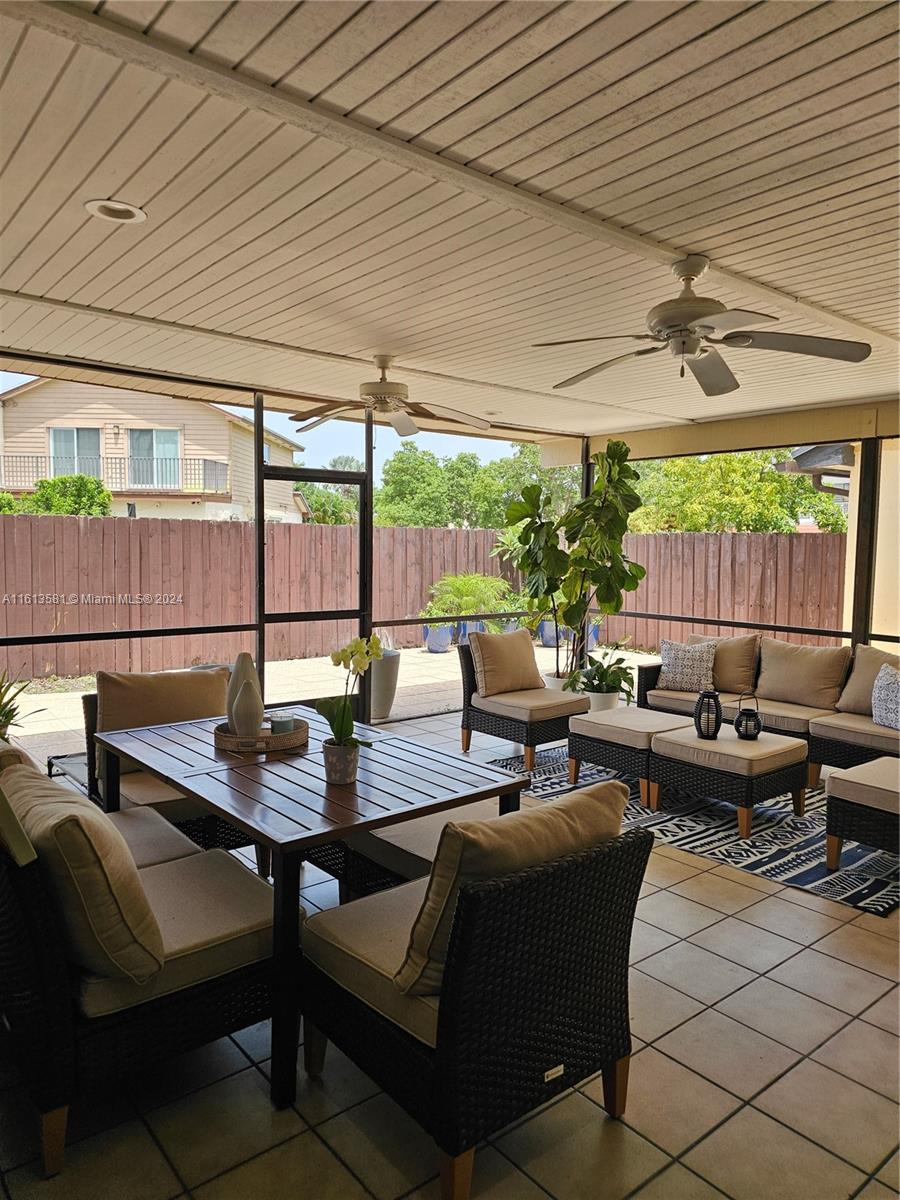 4323 Southwest 148th Place Miami, FL 33185 - Photo 46 of 70 a living room with furniture and a potted plant