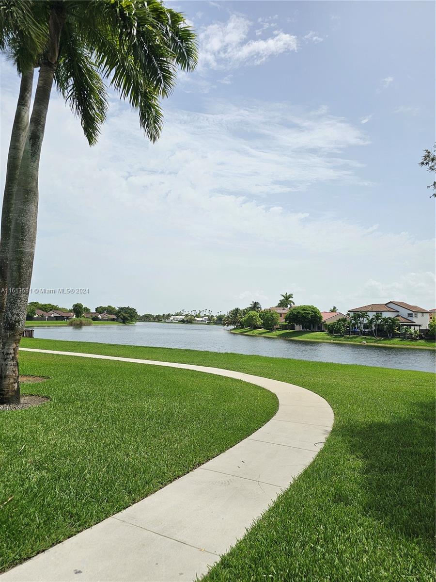 4323 Southwest 148th Place Miami, FL 33185 - Photo 65 of 70 a view of a lake with a big yard