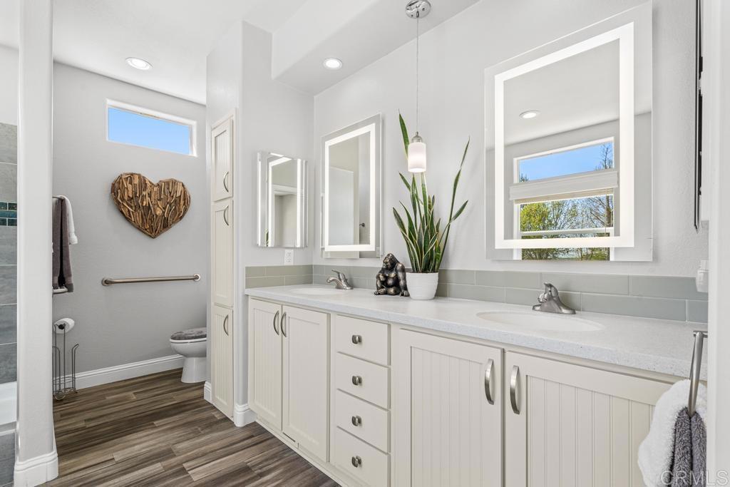 2815 Miller Valley Road Pine Valley, CA 91962 - Photo 20 of 45 a bathroom with a granite countertop sink mirror vanity and toilet