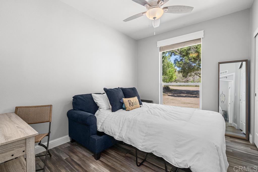 2815 Miller Valley Road Pine Valley, CA 91962 - Photo 22 of 45 a bedroom with a bed and wooden floor