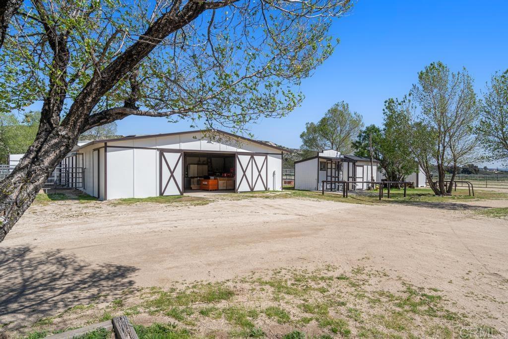 2815 Miller Valley Road Pine Valley, CA 91962 - Photo 27 of 45 a front view of a house with a yard and garage