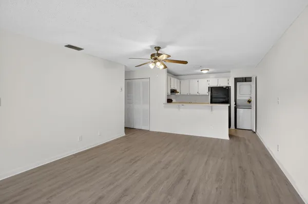a view of a kitchen with wooden floor
