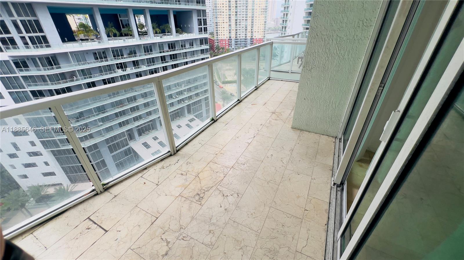 218 Southeast 14th Street, Unit 1504 Miami, FL 33131 - Photo 8 of 15 a view of balcony with wooden floor