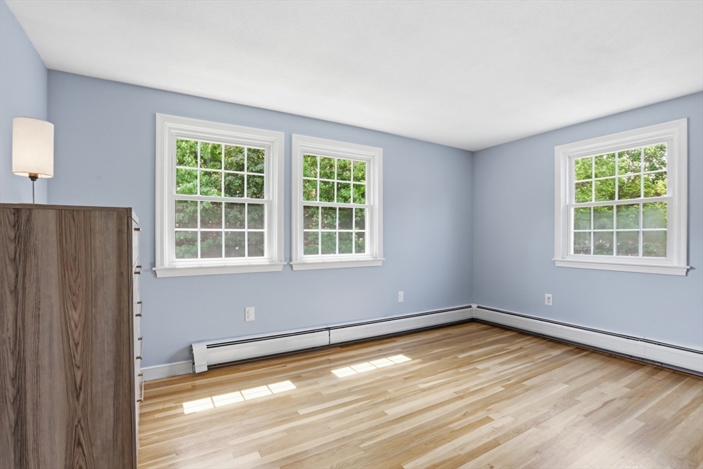 94 Johnson Road Winchester, MA 01890 - Photo 24 of 40 a view of empty room with wooden floor and fan