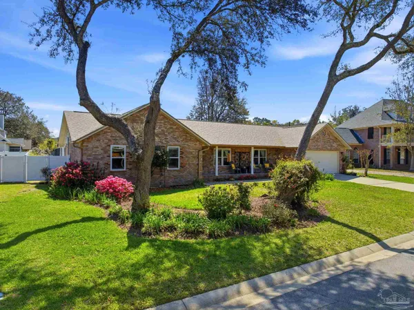 a front view of house with garden