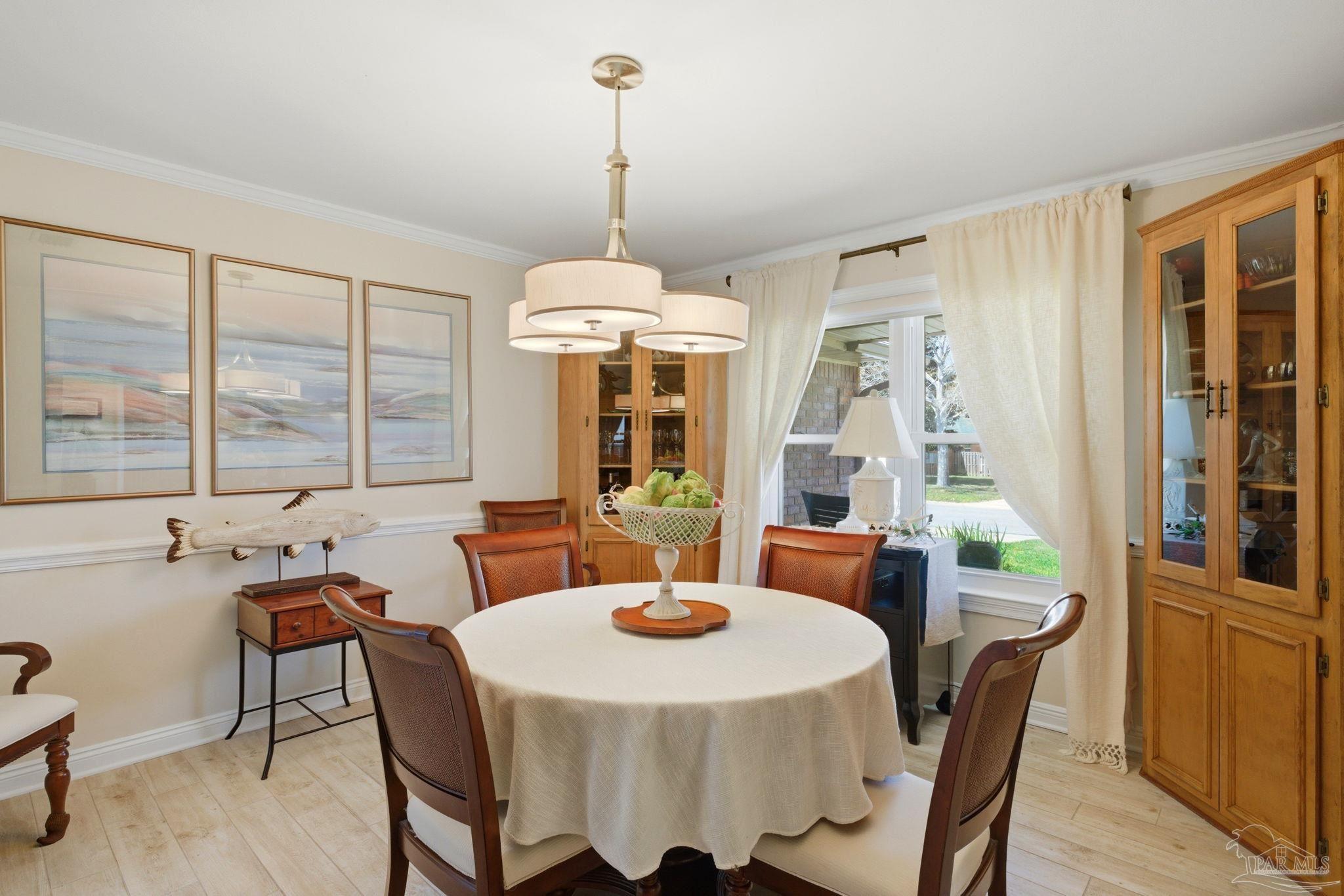 6550 Chardonnay Pensacola, FL 32504 - Photo 13 of 42 a view of a dining room with furniture window and outside view