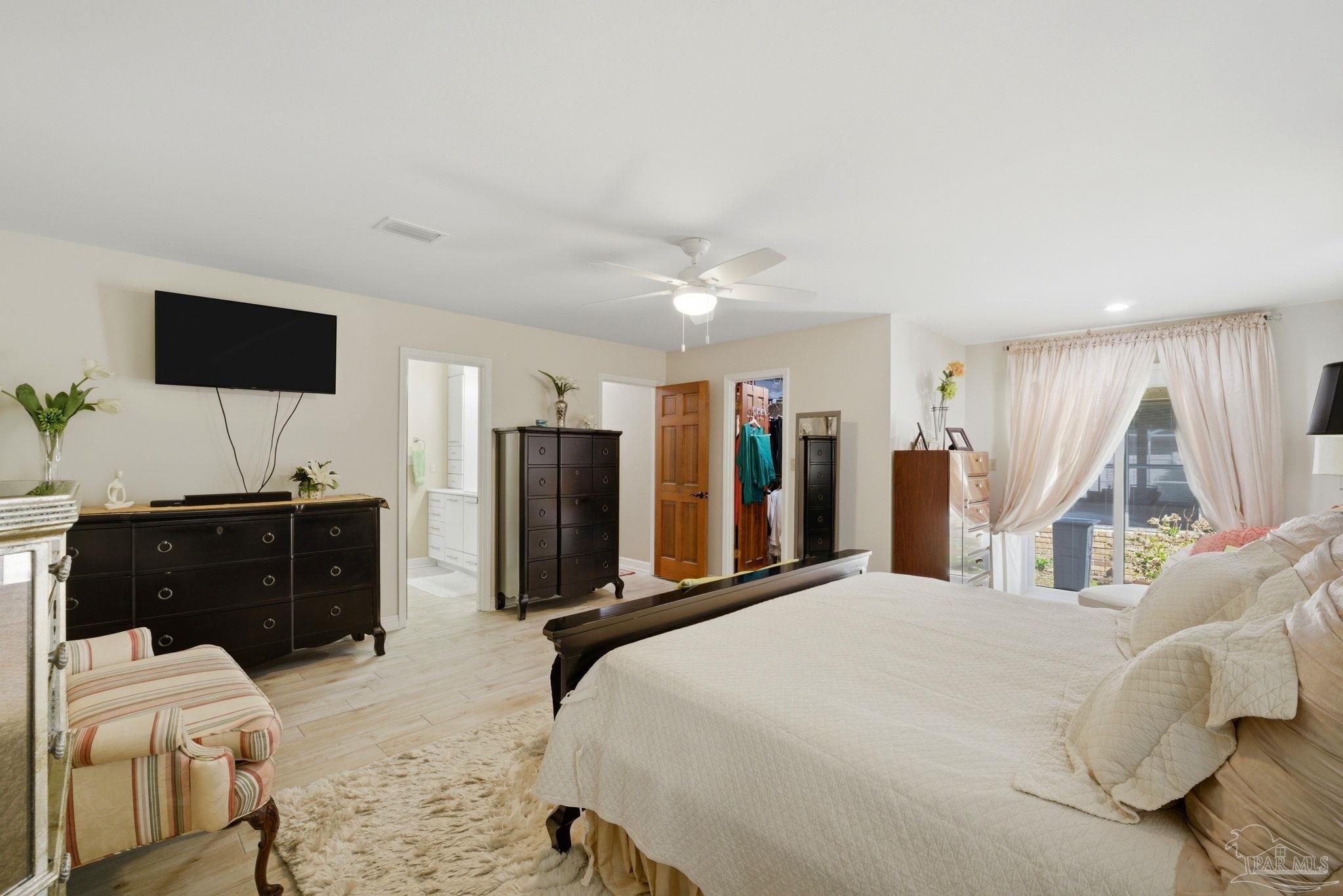 6550 Chardonnay Pensacola, FL 32504 - Photo 17 of 42 a bedroom with a bed and a flat screen tv