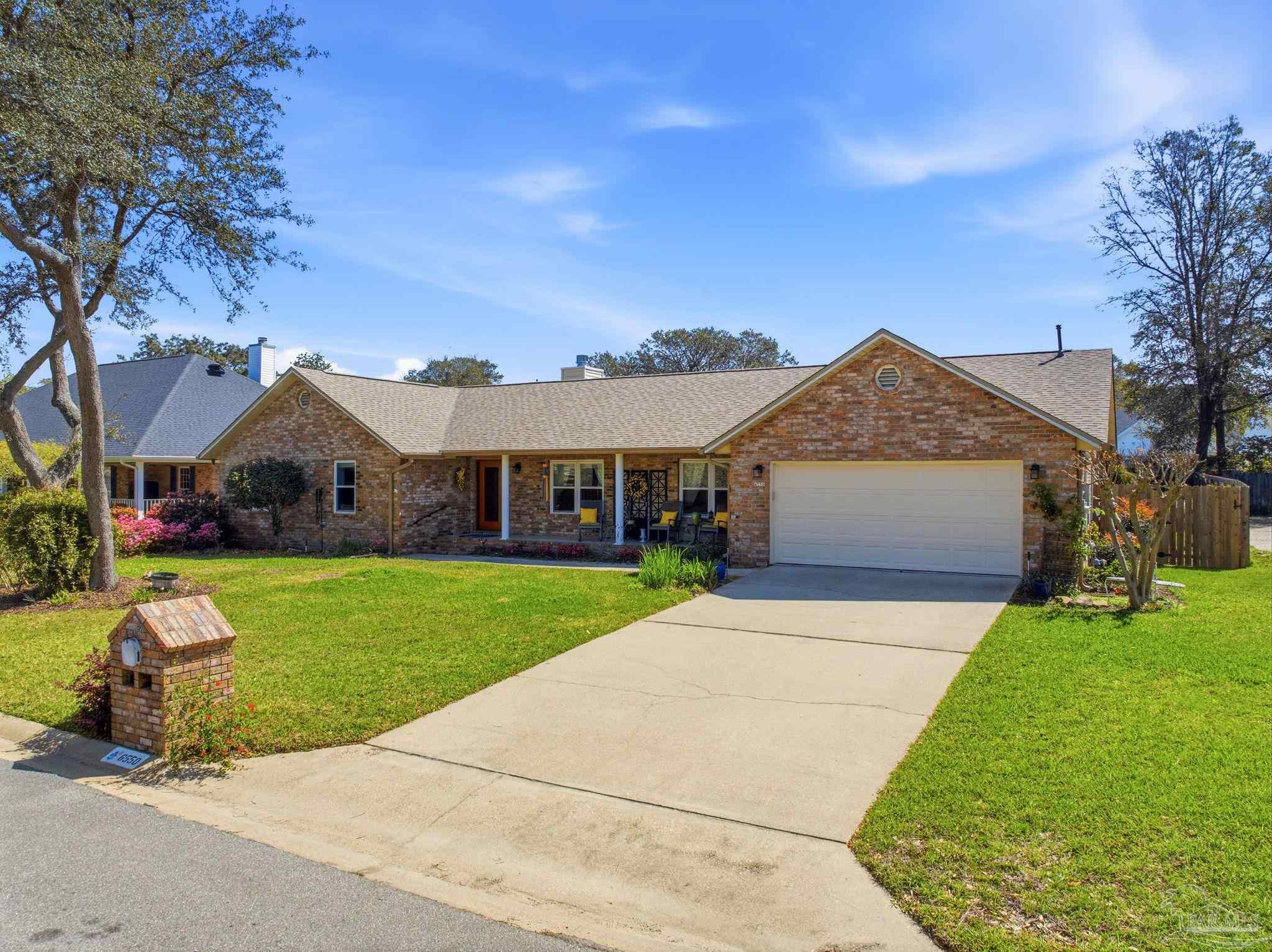 6550 Chardonnay Pensacola, FL 32504 - Photo 2 of 42 a front view of house with yard and green space