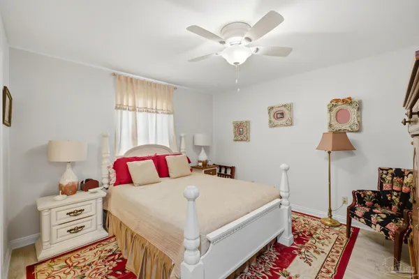 a bedroom with a bed and a television