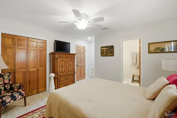 a bathroom with a toilet a sink and a mirror