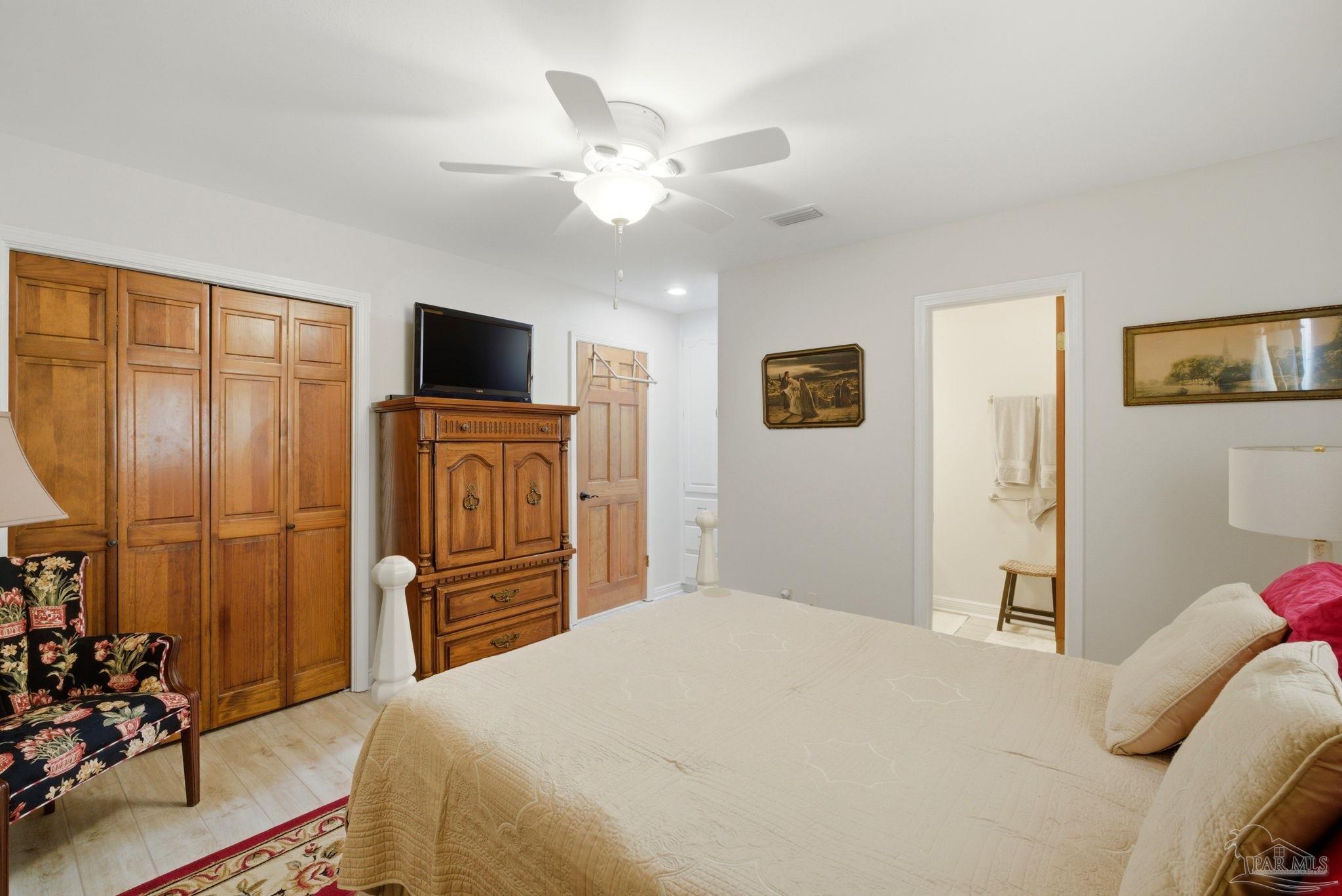 6550 Chardonnay Pensacola, FL 32504 - Photo 23 of 42 a bedroom with a bed and a television