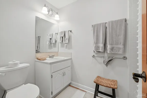 a bathroom with a shower curtain and a sink