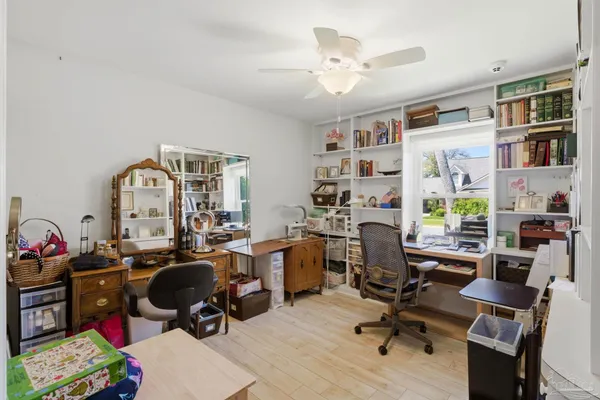 a view of a workspace with furniture and toys