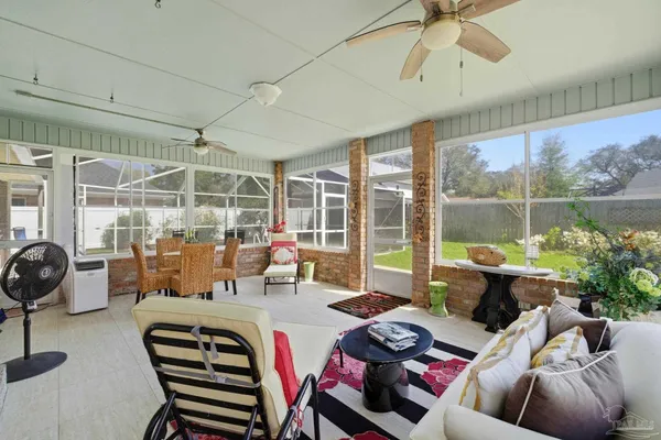 a view of a backyard with swimming pool