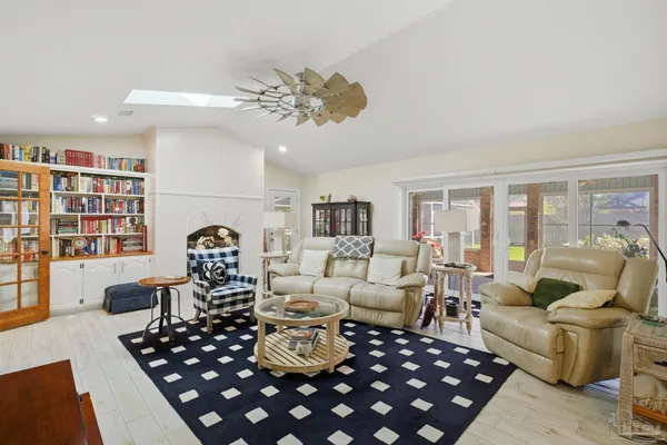 a view of kitchen with sink microwave and cabinets