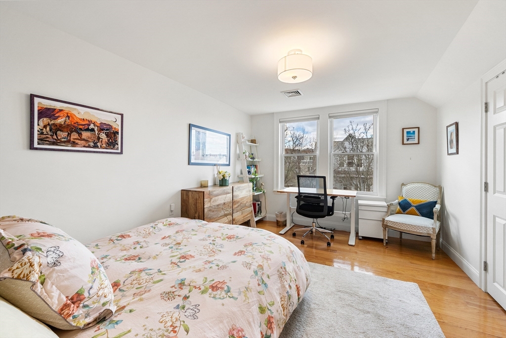 25 Fenwick Street, Unit 2 Somerville, MA 02145 - Photo 13 of 22 a bedroom with a large bed and a window