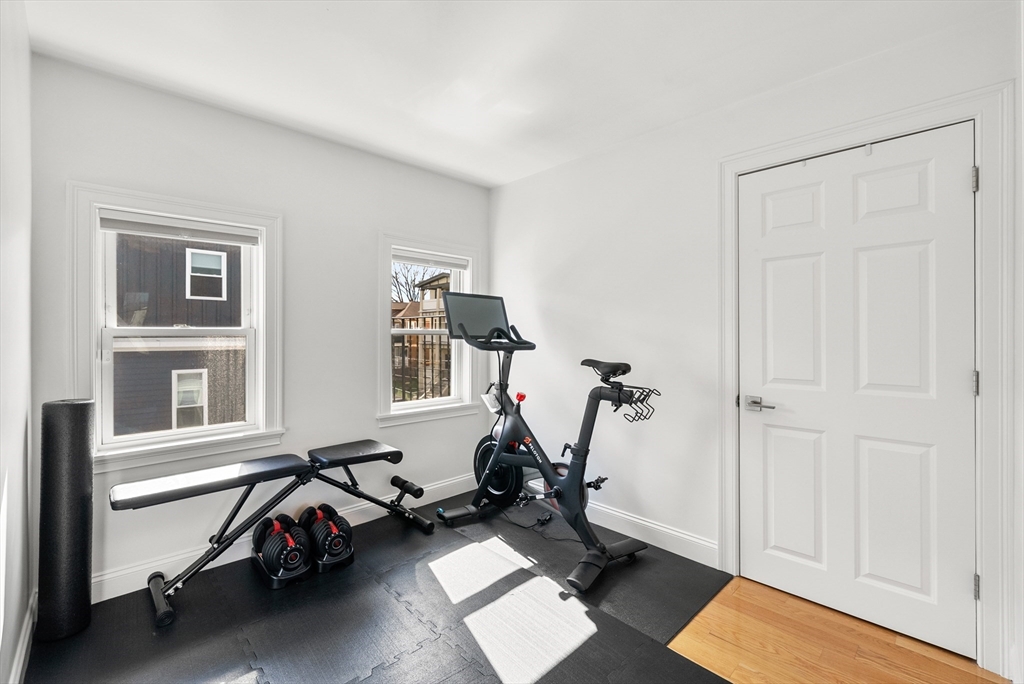 25 Fenwick Street, Unit 2 Somerville, MA 02145 - Photo 15 of 22 a view of a room with gym equipment