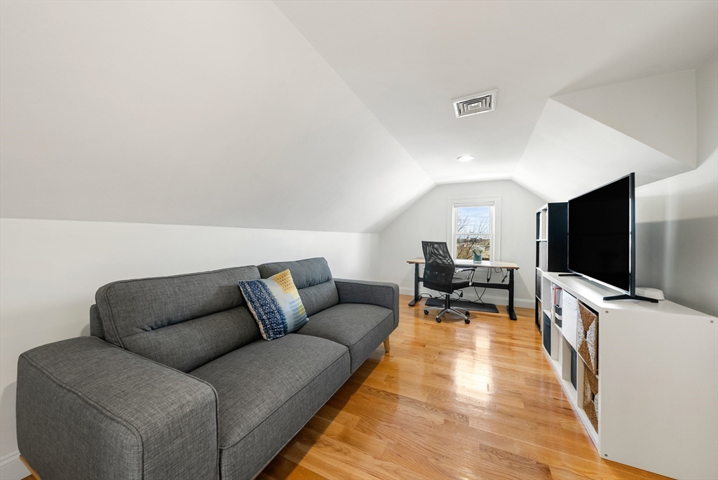 25 Fenwick Street, Unit 2 Somerville, MA 02145 - Photo 16 of 22 a living room with furniture and a flat screen tv