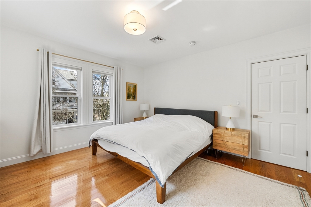 25 Fenwick Street, Unit 2 Somerville, MA 02145 - Photo 7 of 22 a bedroom with a bed and window